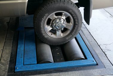 A car getting fixed at The Muffler Shop