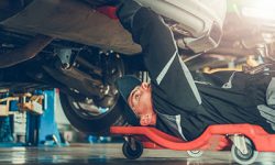 A mechanic fixing a car